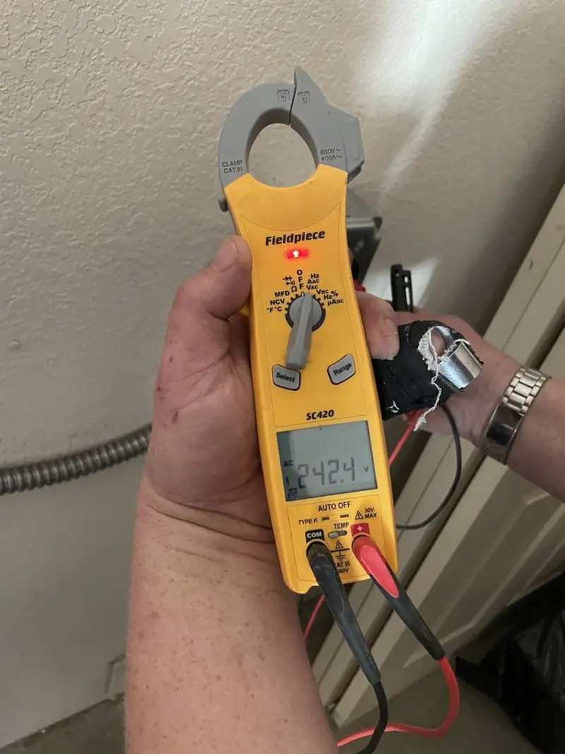 Voltage testing with clamp meter during Ceiling Fan Installation in Laplace